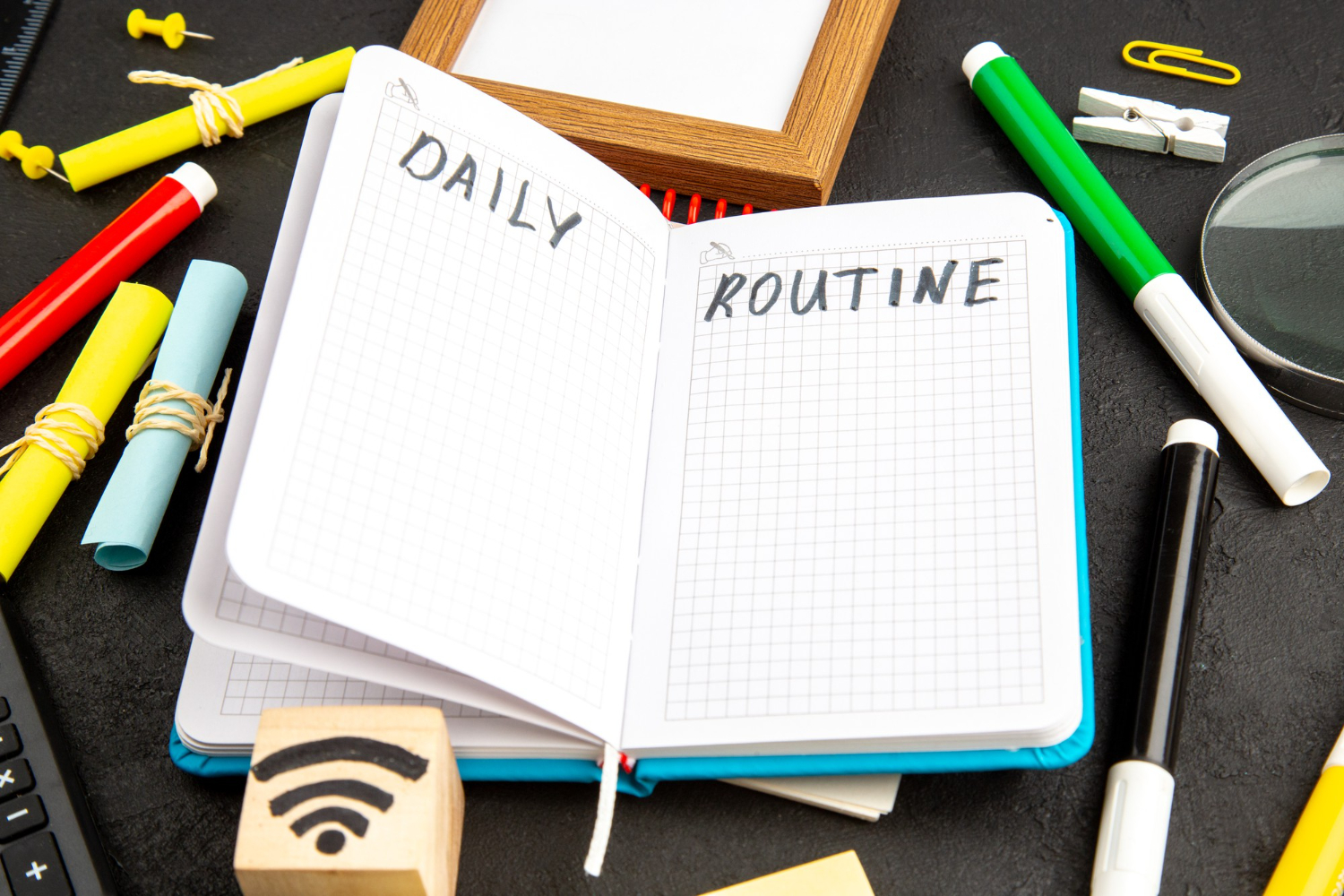 a notebook with daily routine written on it
