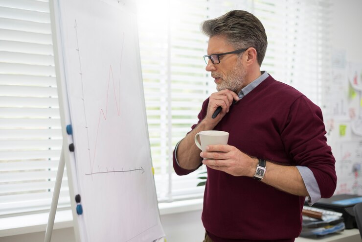 Man writing Personalize Your Break Strategy on a whiteboard, planning his approach with a thoughtful expression.